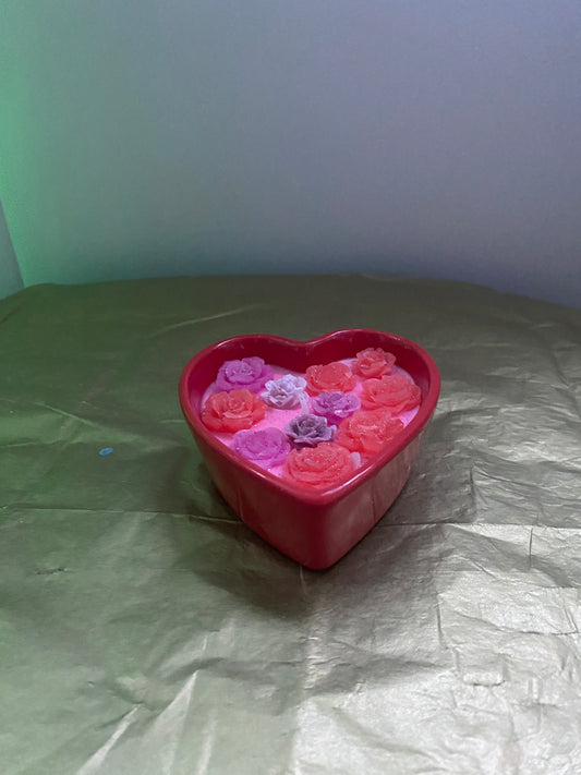 Heart-shaped ceramic red candle