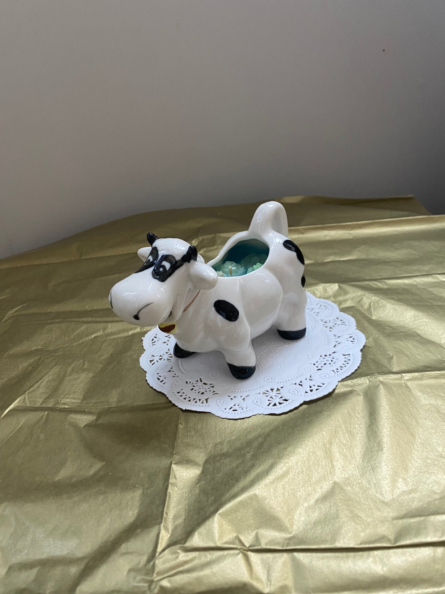 Ceramic cow candle